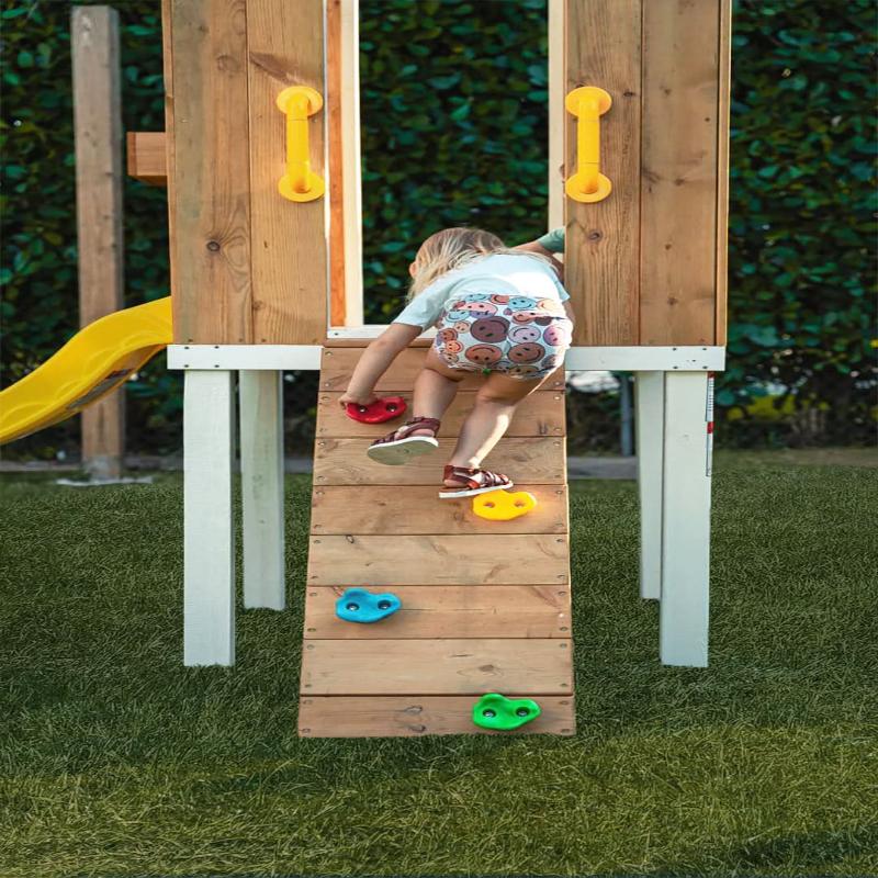 Child climbing on the Avenlur Forest climbing Wall.