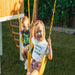 2 children swinging on the Avenlur Forest Playset