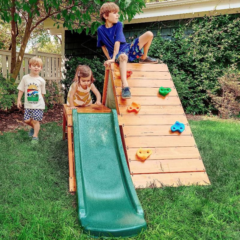 3 children playing on the Avenlur Palm Playset